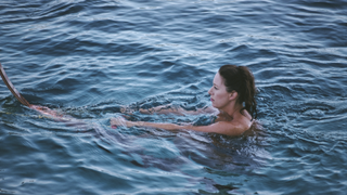Princess Margaret, Countess of Snowdon (1930 - 2002), swimming while on holiday in Costa Smeralda, Sardinia, Italy, August 1987