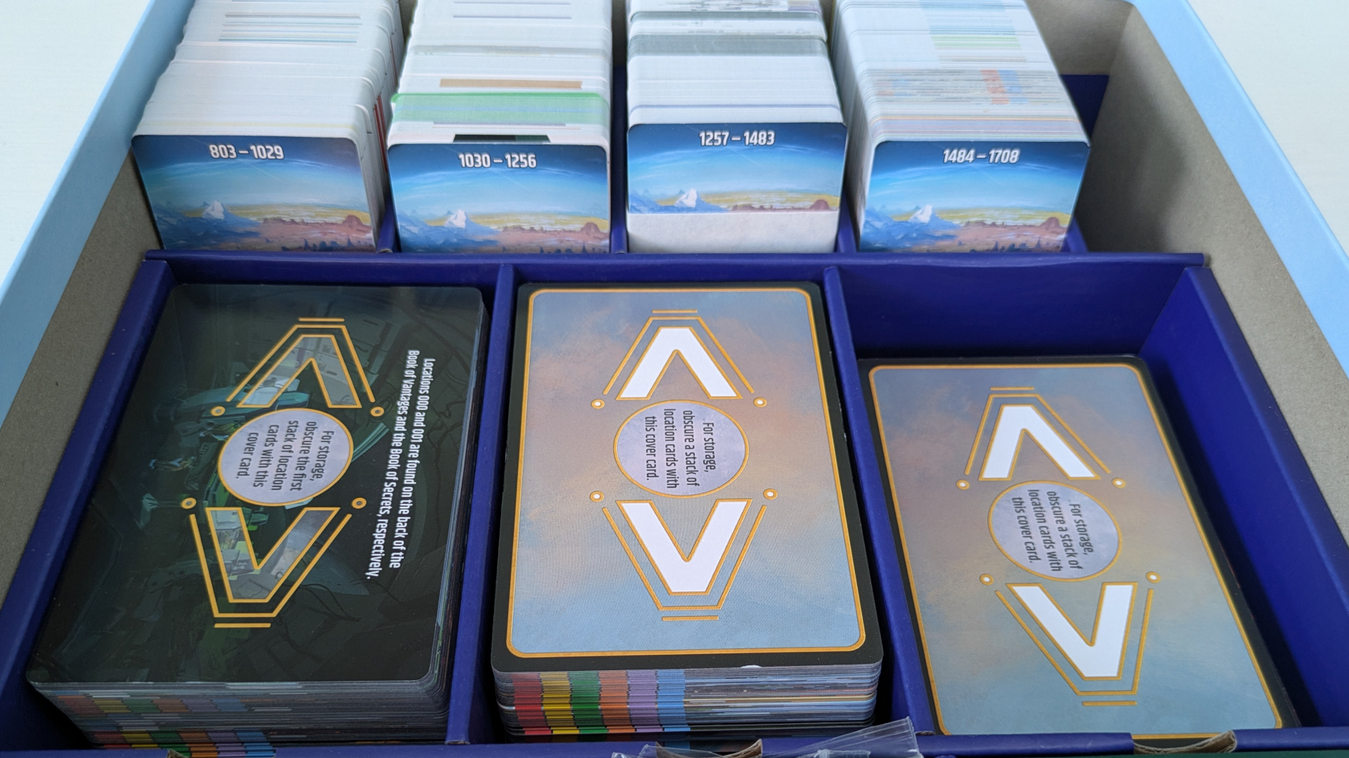An array of Vantage cards, set up in the Vantage box