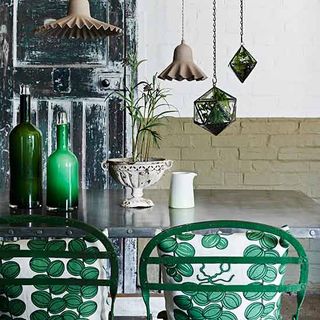 dining room with green chairs
