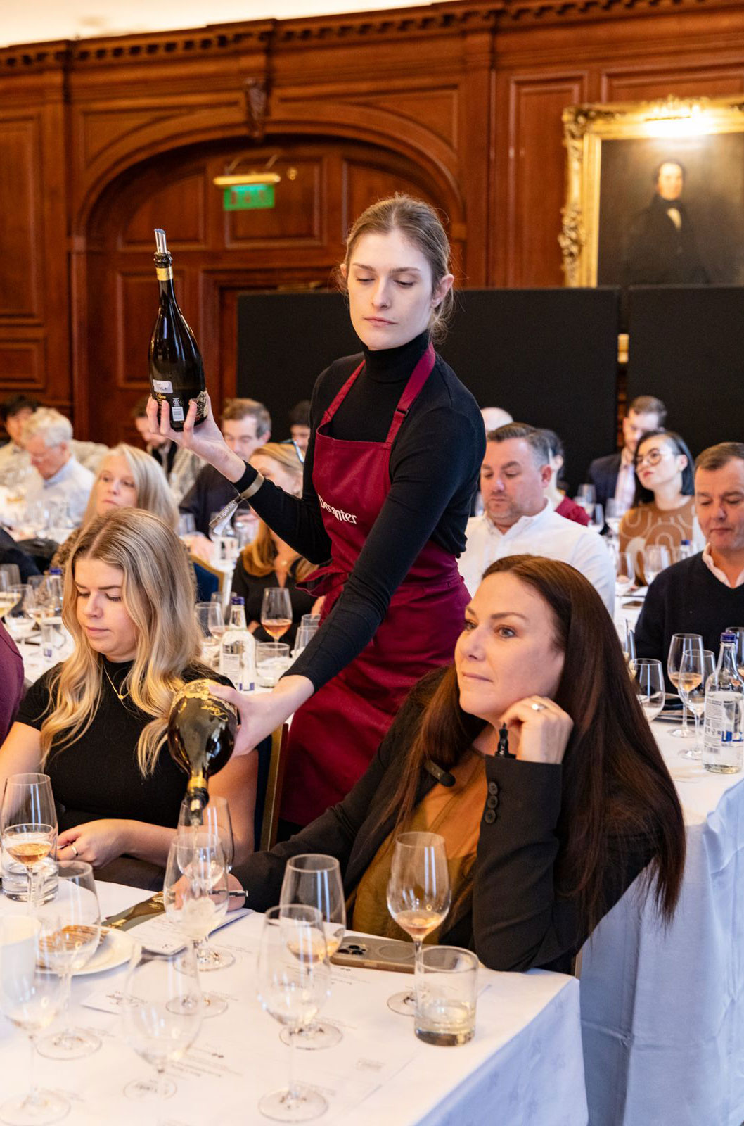 Pouring wine at the DFWE London 2024 Rare Champagne masterclass