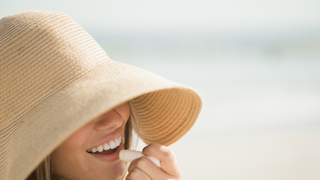Facial expression, Skin, Hat, Clothing, Sun hat, Smile, Nose, Headgear, Fashion accessory, Beige,