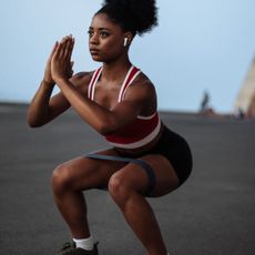 A woman trying one of the best advanced resistance band leg workouts