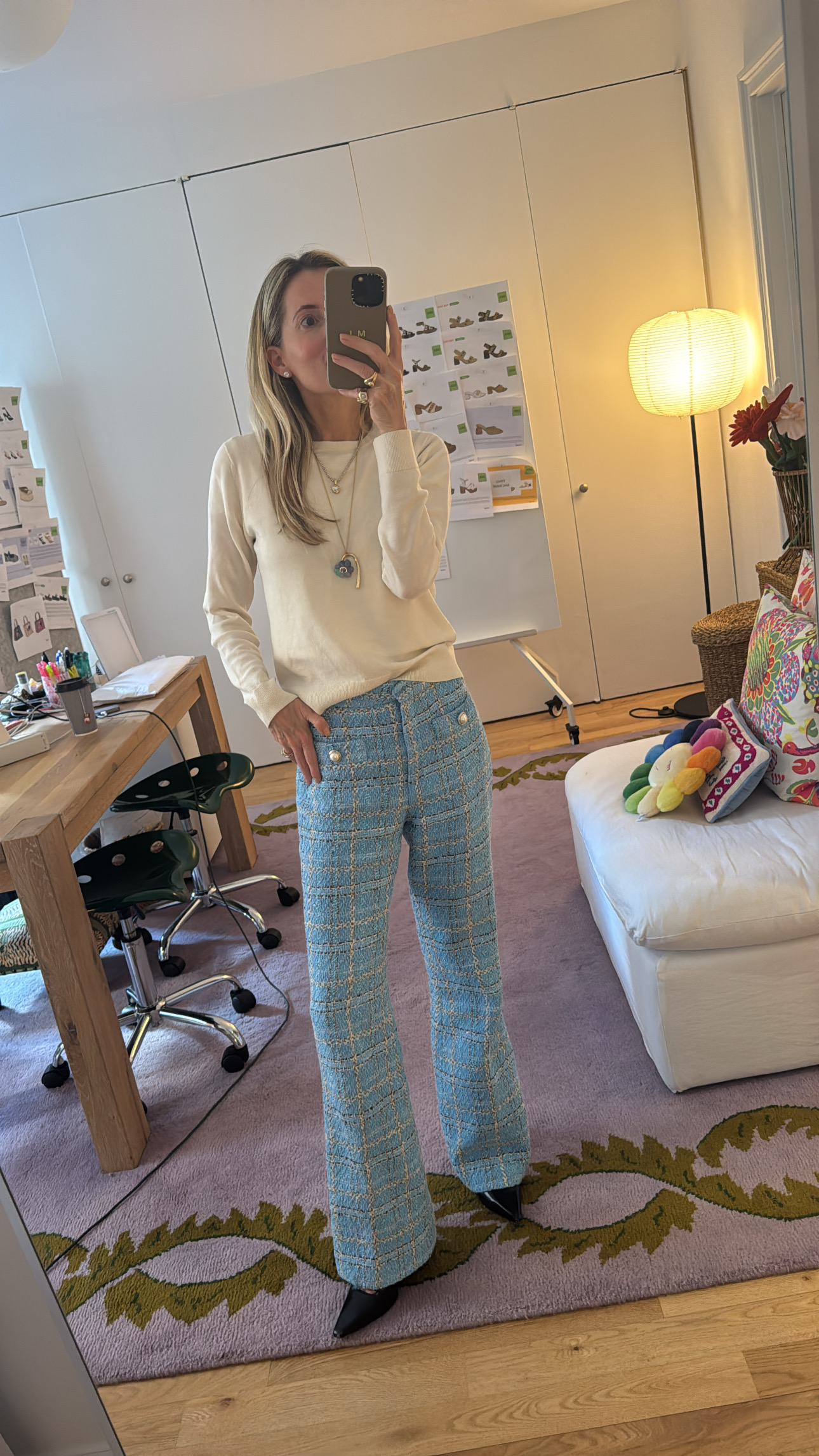 Marina Larroudé wearing blue tweed pants and a white cashmere sweater