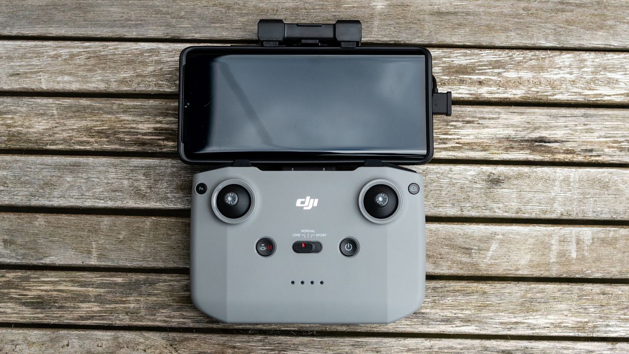 A controller for the DJI Air 2S drone on a wooden table