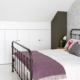 bedroom with white wardrobe and bedside table