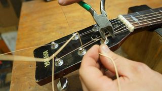 Trimming excess string from a guitar