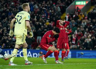 Takumi Minamino, centre, reacts after missing a golden chance for Liverpool
