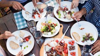 Group of people eating Mediterranean diet foods