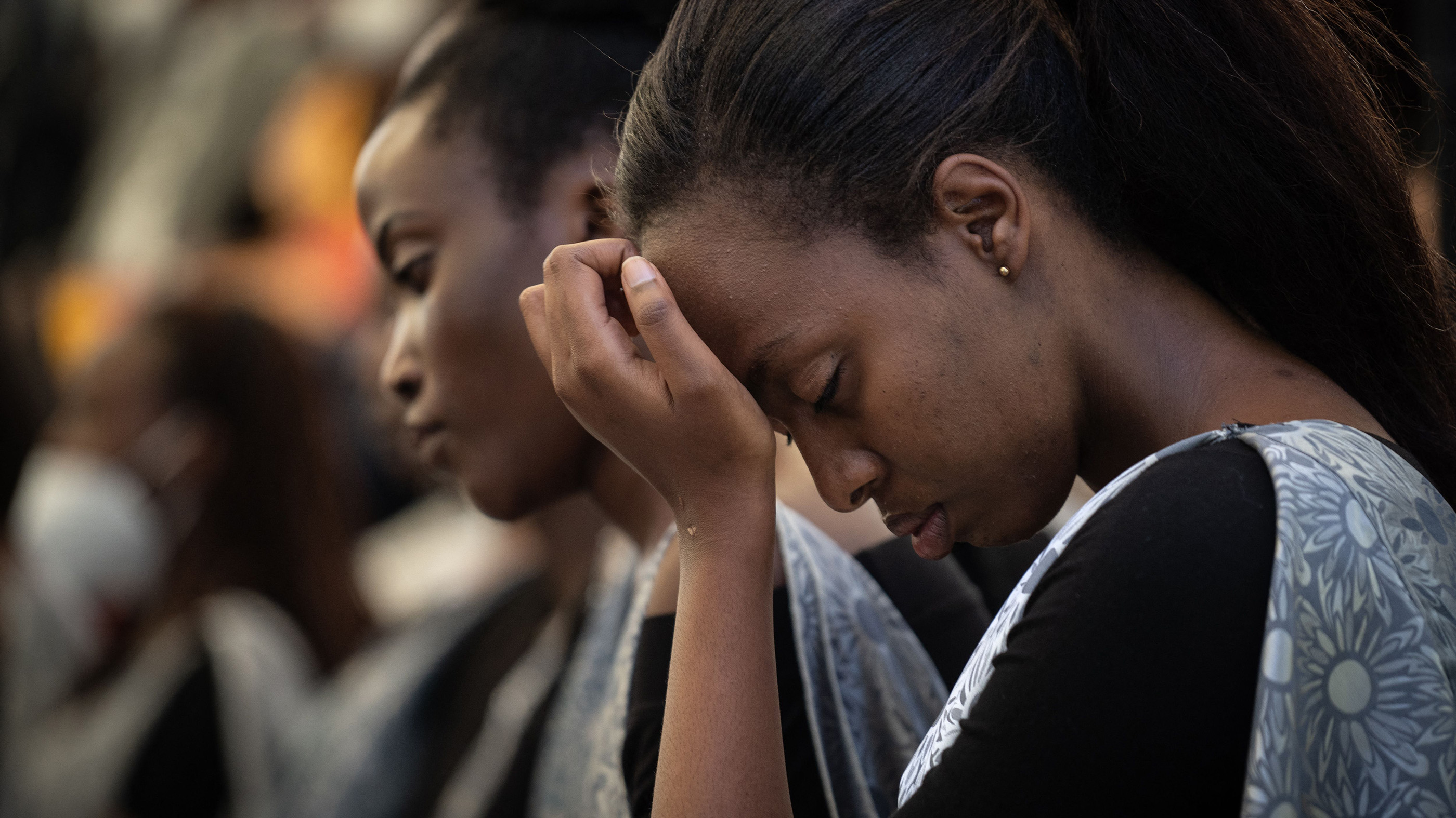 An attendee reacts during the ceremony at Gisozi Genocide Memorial, Kigali, Rwanda on April 7, 2022. The memorial is in commemoration of the 1994 genocide, in which 800,000 mostly Tutsis, but also moderate Hutus, were slaughtered.