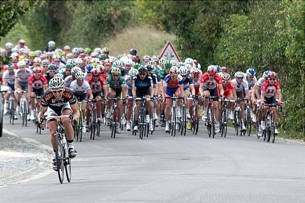 The bunch fans across the road as Mallegol makes his move.