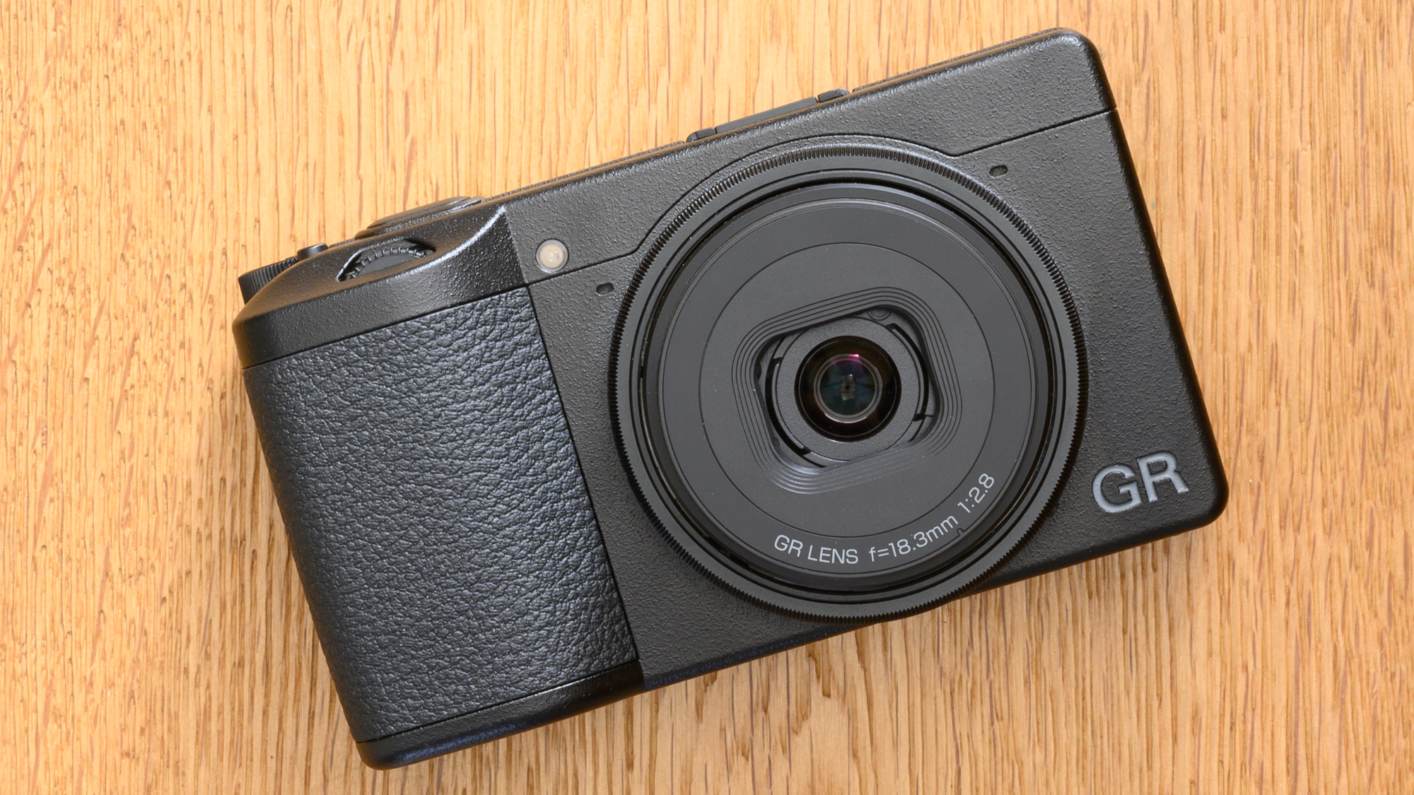 The Ricoh GR III sitting on a wooden table