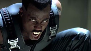 A close up of Wesley Snipes' Blade bearing his teeth in his self-titled 1998 film