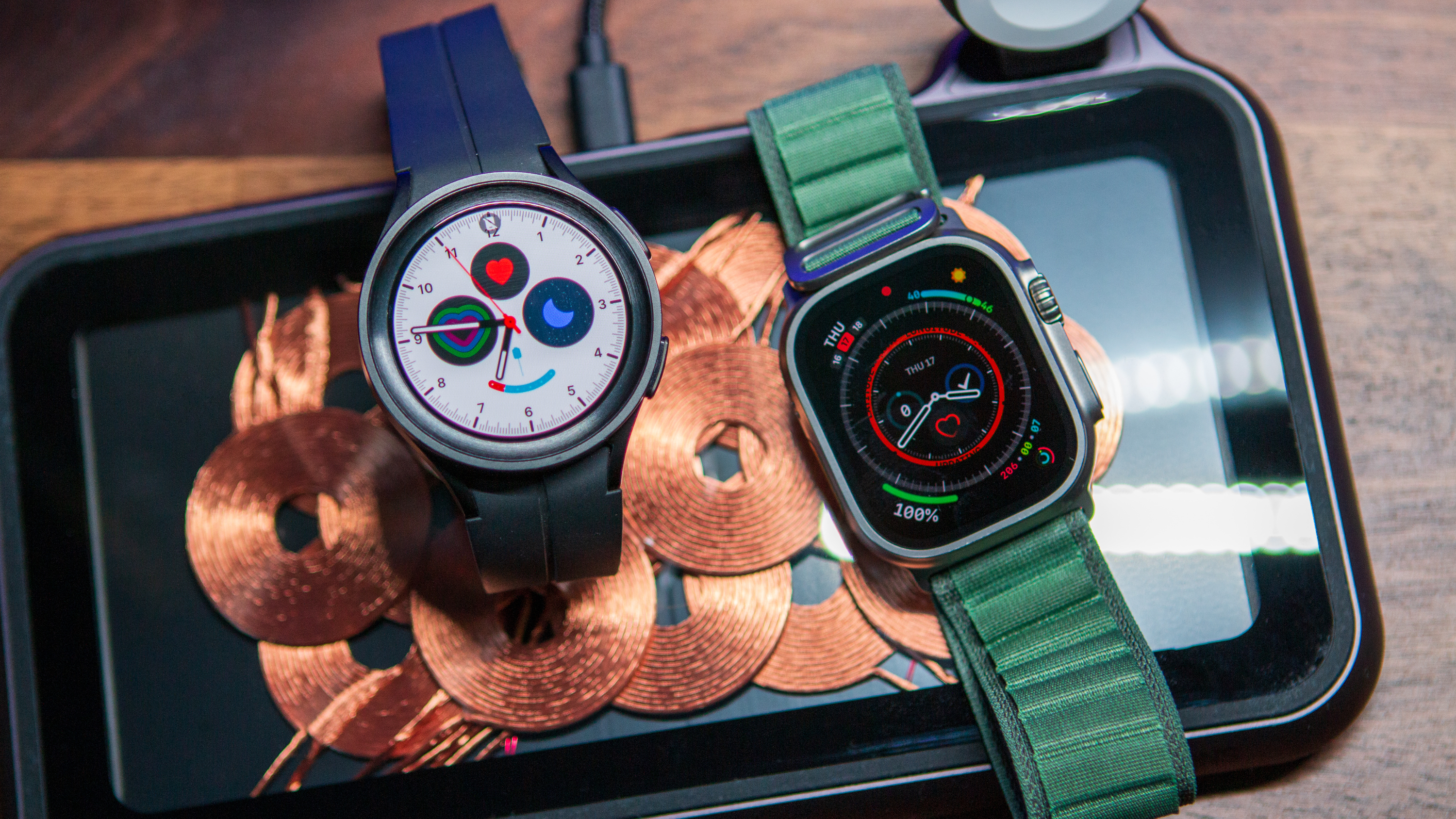 The Samsung Galaxy Watch Pro (left) and Apple Watch Ultra (right) side-by-side.