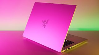 Razer Blade 14 Mercury Edition open showing a logo on the laptop lid