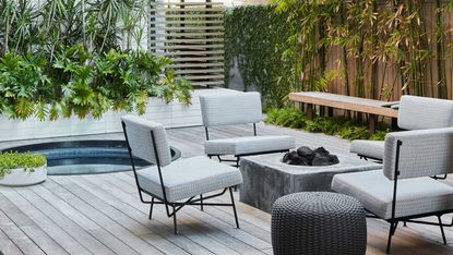 a small courtyard with stylish outdoor furniture