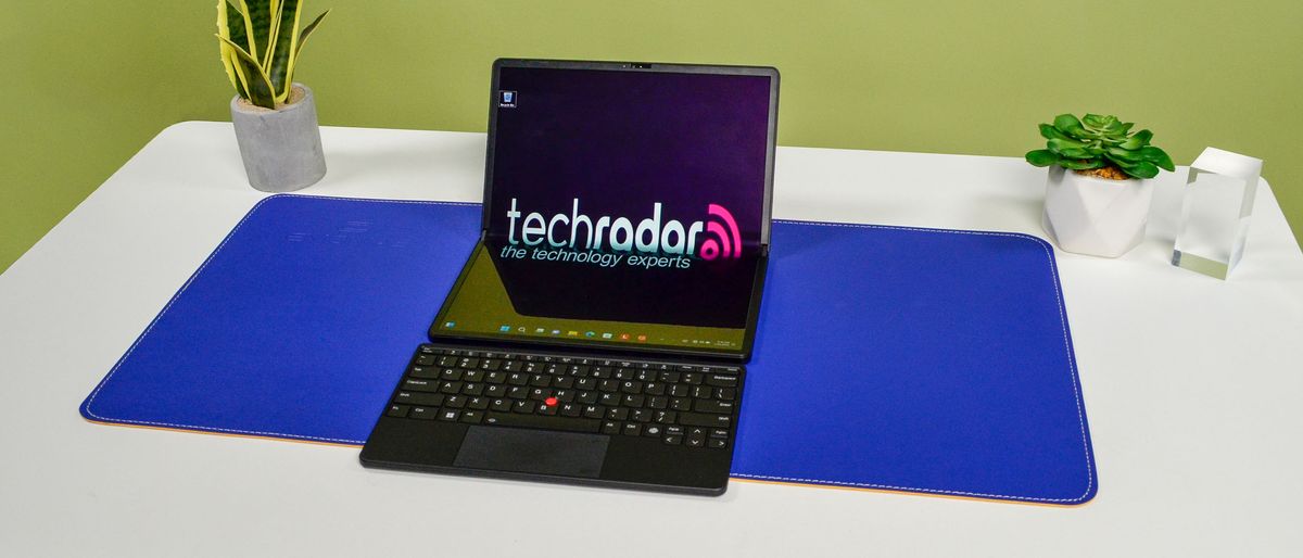 A Lenovo ThinkPad X1 Fold 16 Gen 1 on a white desk