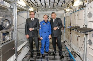 Omega's president Stephen Urquhart (at right) and vice president Jean-Claude Monachon (at left) with ESA astronaut Jean François Clervoy, whose invention is in the new Skywalker X-33.