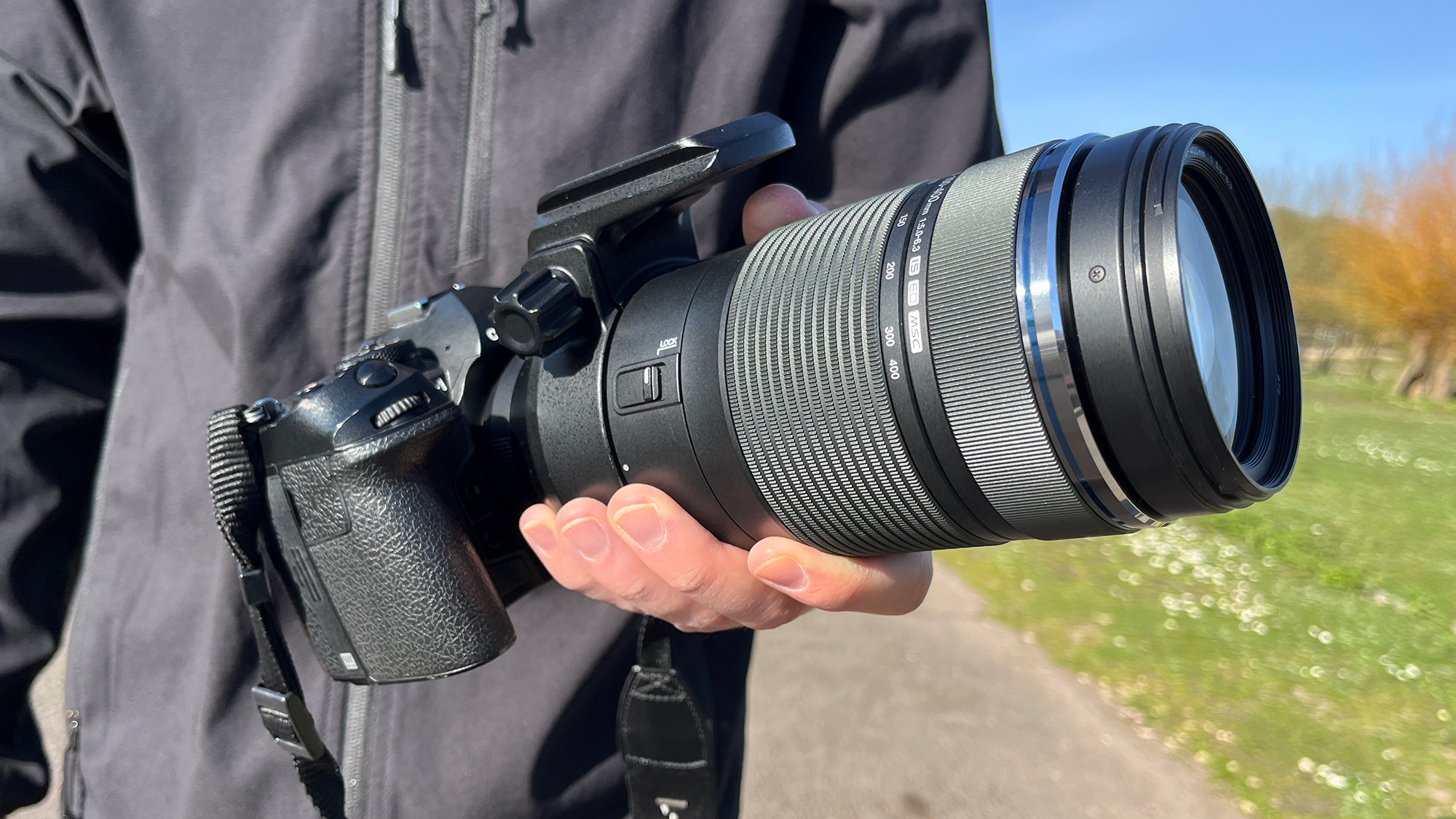 Mike Harris with M.Zuiko Digital ED 100-400mm f/5.0-6.3 IS in rural setting with blue sky