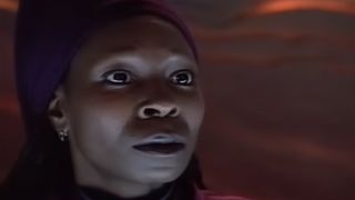 A close up of Whoopi Goldberg looking calm in Star Trek: The Next Generation