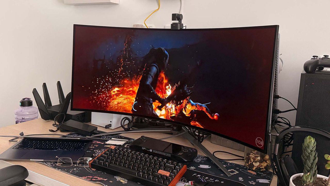 Acer Predator X39 OLED gaming monitor on a desktop with a PC game on the screen