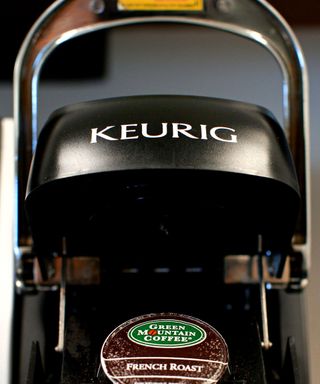 Close up of a black and silver Keurig coffee machine