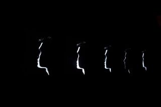 silhouettes of mens faces on a black background