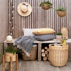 garden with willow tray table bamboo flowerpot and seagrass hanging baskets