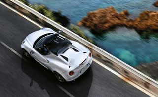 White Alfa Romeo 4C Spider on the road