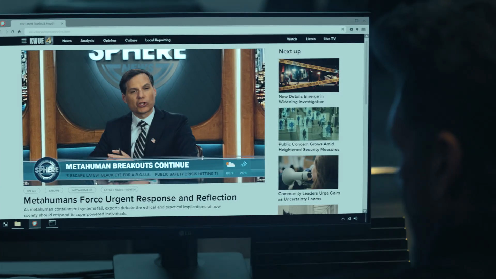 Rick Flag Sr watching a news report on a computer monitor in Peacemaker season 2 episode 1