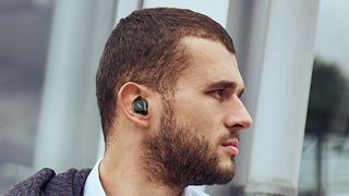 Man wearing Tozo NC7 earbuds.