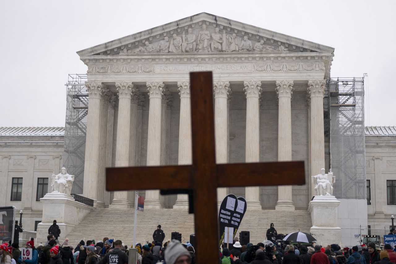 Demonstrators holds a cross during in the March For Life anti abortion rally in front of the US Supreme Court in Washington, DC on January 19, 2024