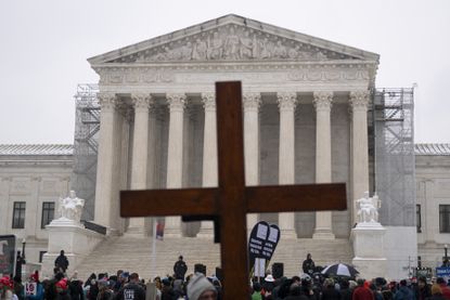 Demonstrators holds a cross during in the March For Life anti-abortion rally in front of the US Supreme Court in Washington, DC on January 19, 2024