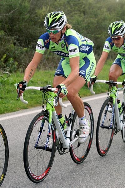 Pozzato surrounded by team-mates.