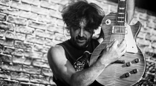 Doug Rappoport wields a Les Paul onstage