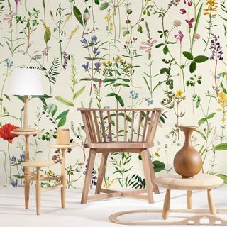 floral wallpaper in pale green tones with wooden furniture