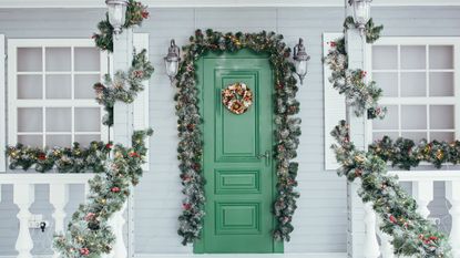 Christmas festive decorated green door