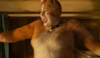 Rebel Wilson looking really excited and dancing as a cat in Cats.