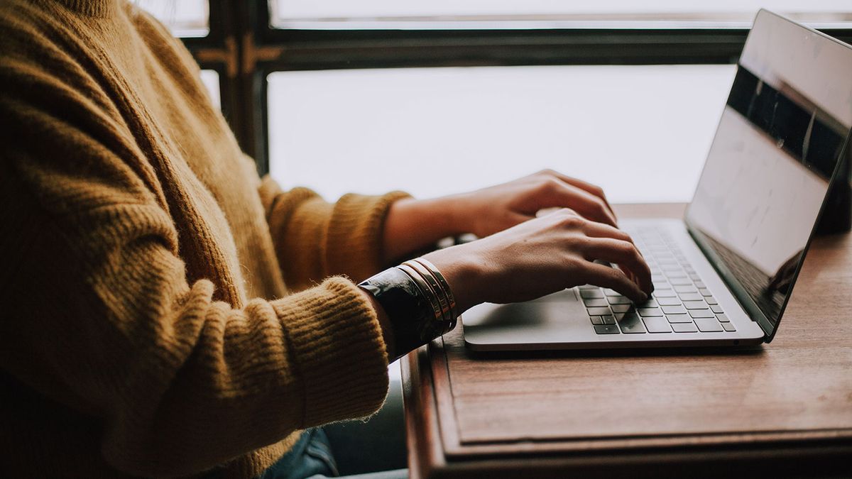 Person typing on a laptop