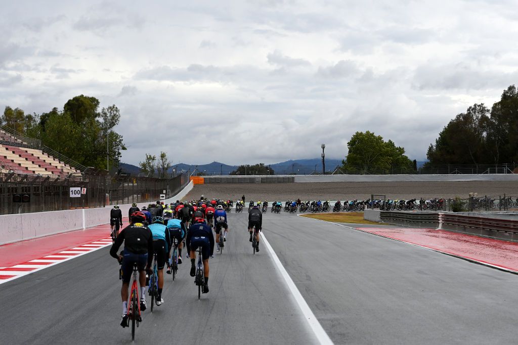 BARCELONA SPAIN AUGUST 27 A general view of the peloton passing through the F1 Circuit de BarcelonaCatalunya during the 78th Tour of Spain 2023 Stage 2 a 1818km stage from Matar to Barcelona UCIWT on August 27 2023 in Barcelona Spain Photo by Tim de WaeleGetty Images