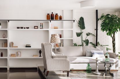 A living room with built in shelves