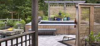 above ground pool surrounded by wooden decking