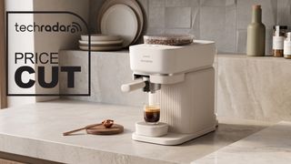 White Philips Baristina coffee machine on a kitchen counter.
