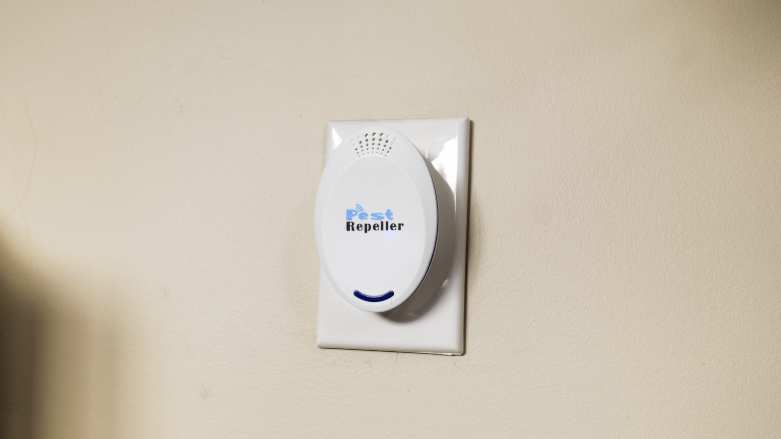 Ultrasonic pest repeller installed on outlet.