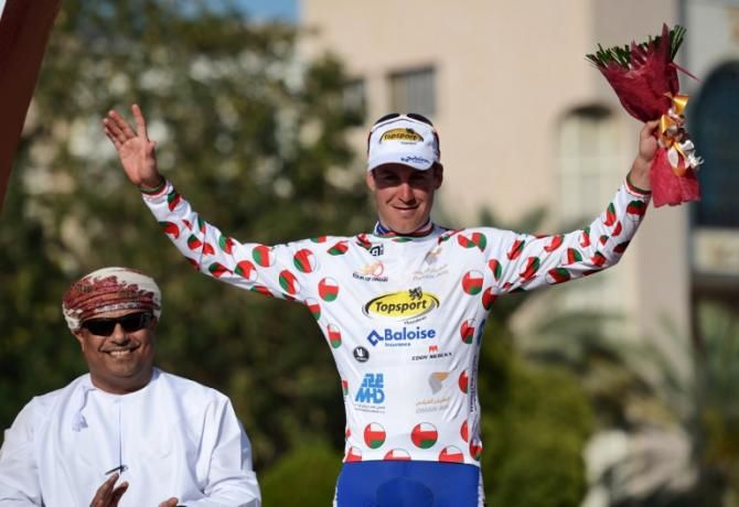 Belgian Wallays Jelle of Topsport Vlaanderen-Baloise team celebrates on the podium as he receives white jersey for the most aggressive rider