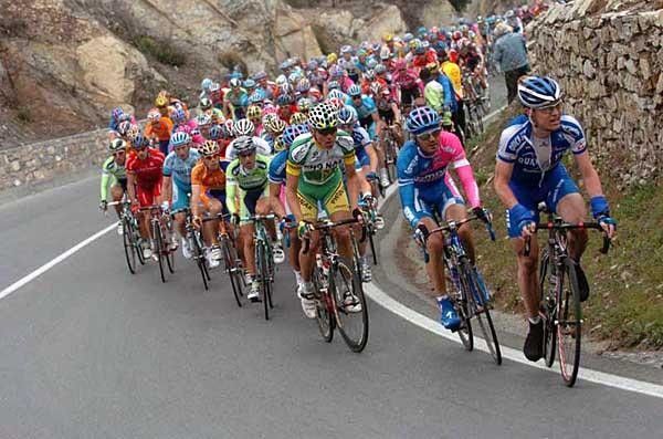 The going gets tough as riders make their way up the Poggio