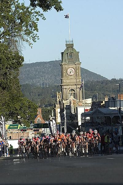 The peloton in the men's open criterium race make their way up Sturt Street in Ballarat with the Town Hall in the background.