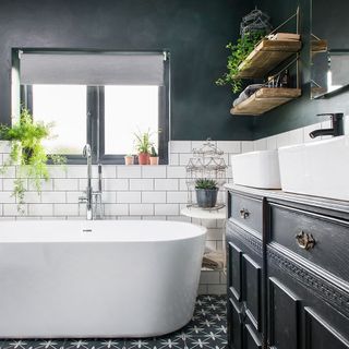 bathroom with white bathtub and open shelve