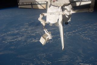 Astronaut Ron Garan Carries the Pump Module