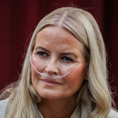 Crown Princess Mette-Marit wearing an oxygen tube