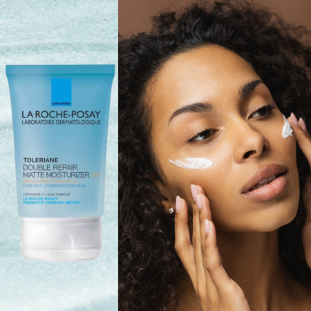 A woman with two swipes of SPF on her cheeks next to a bottle of sunscreen.